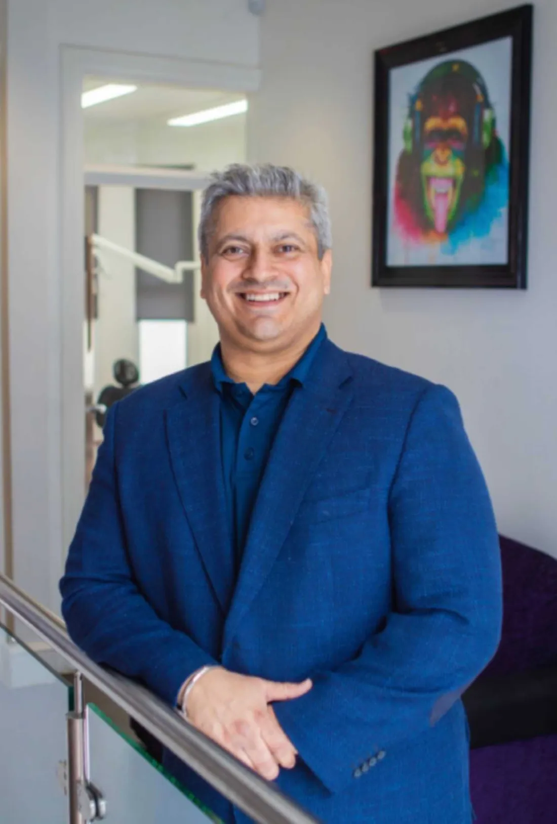Dr Jag Shergill standing on the practice staircase