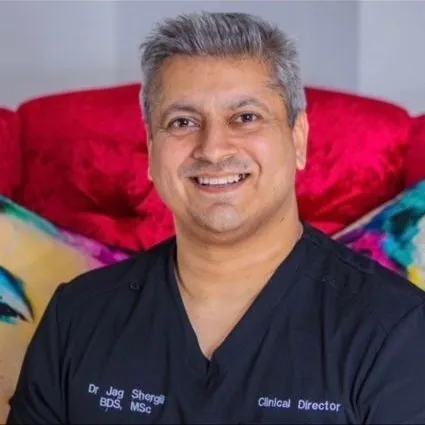 Dr Jag Shergill in clinical scrubs