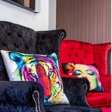 A velvet chair and pop-art cushion in the waiting room